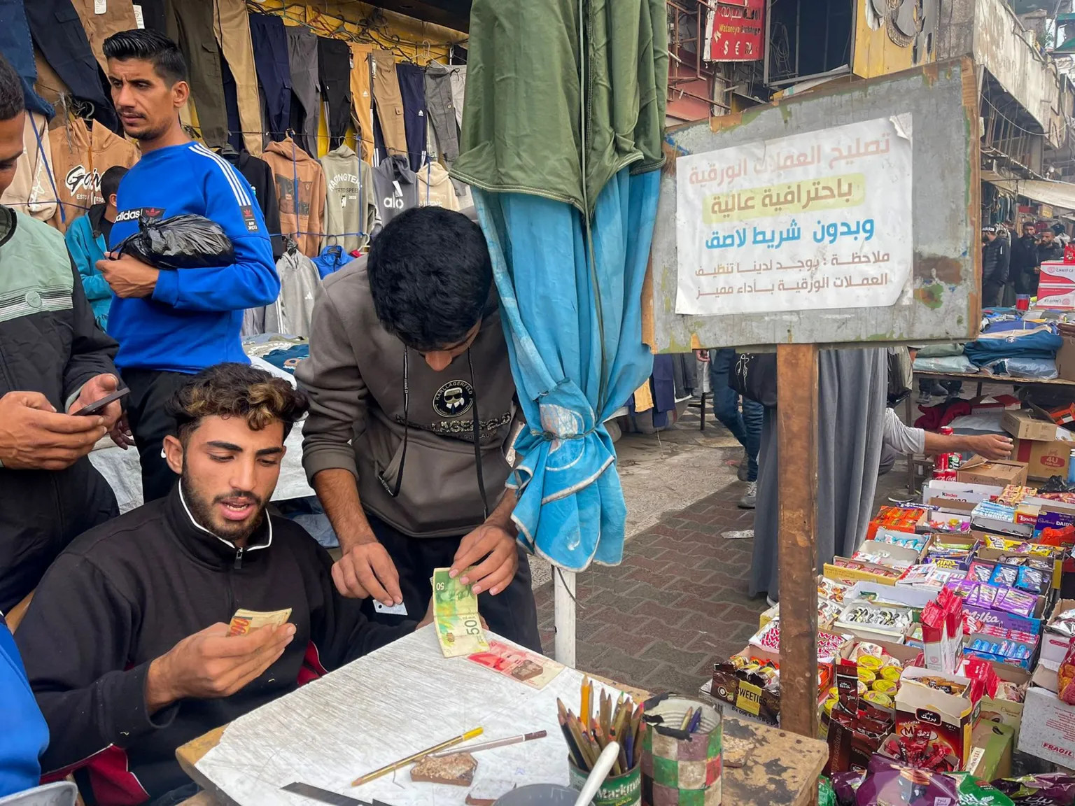 Gaza’s cash crisis fuels banknote repair trade amid economic collapse