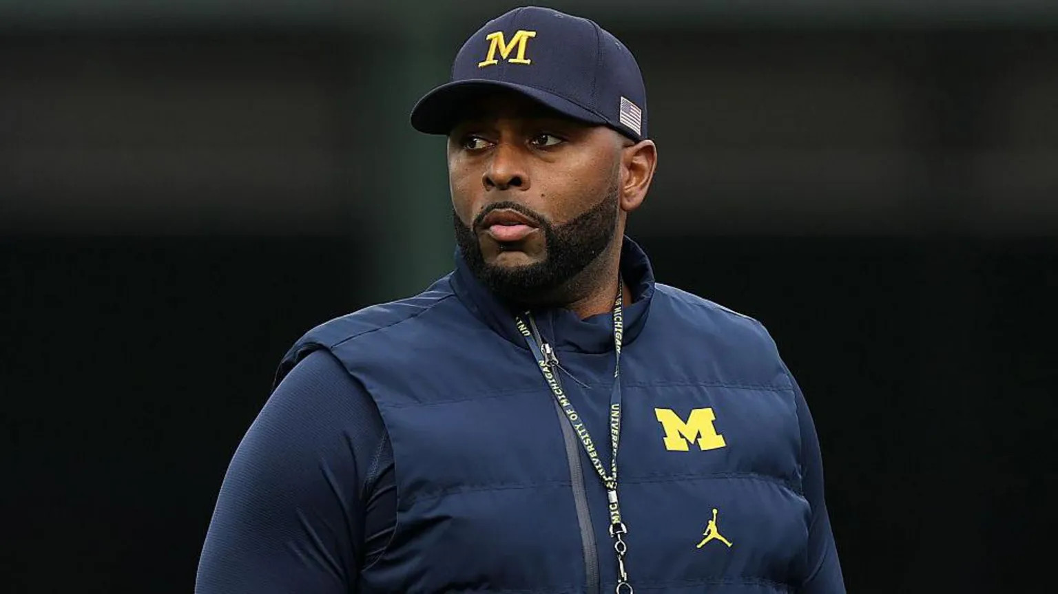 Ex-Michigan football coach charged with home invasion and stalking