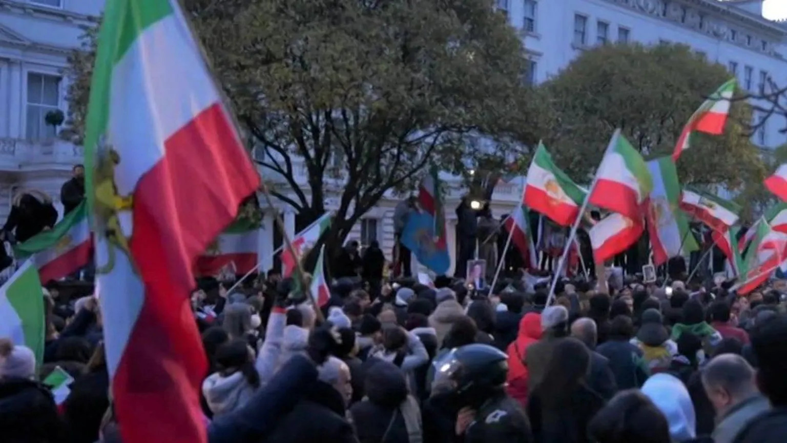 Protester scales Iranian embassy balcony in London as global demonstrations continue
