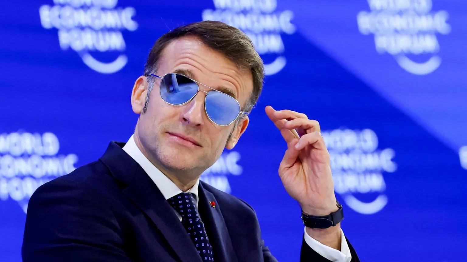 Macron’s indoor sunglasses at Davos spark debate over style and health