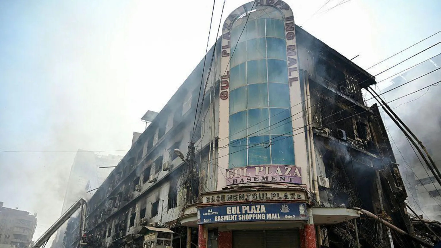 Karachi fire leaves dozens dead and families in anguish over missing loved ones