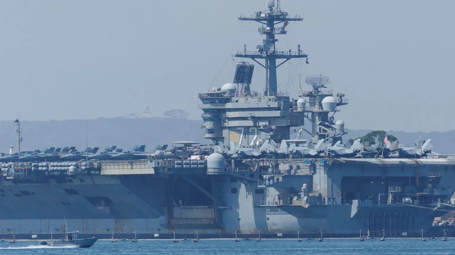 US carrier deployment near Iran raises fears of direct conflict amid crackdown