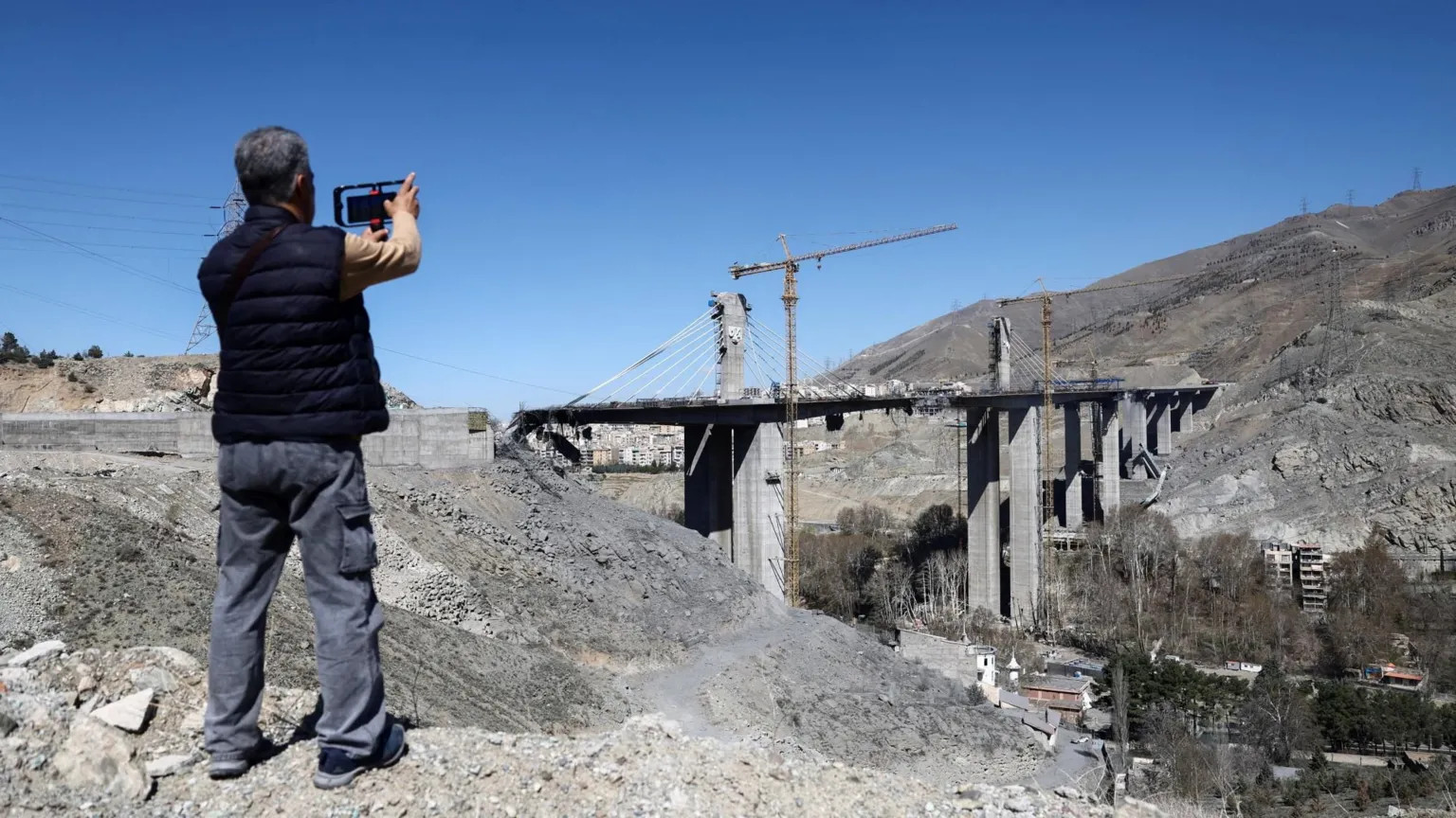 Trump threatens Iranian infrastructure as Karaj bridge strike kills eight