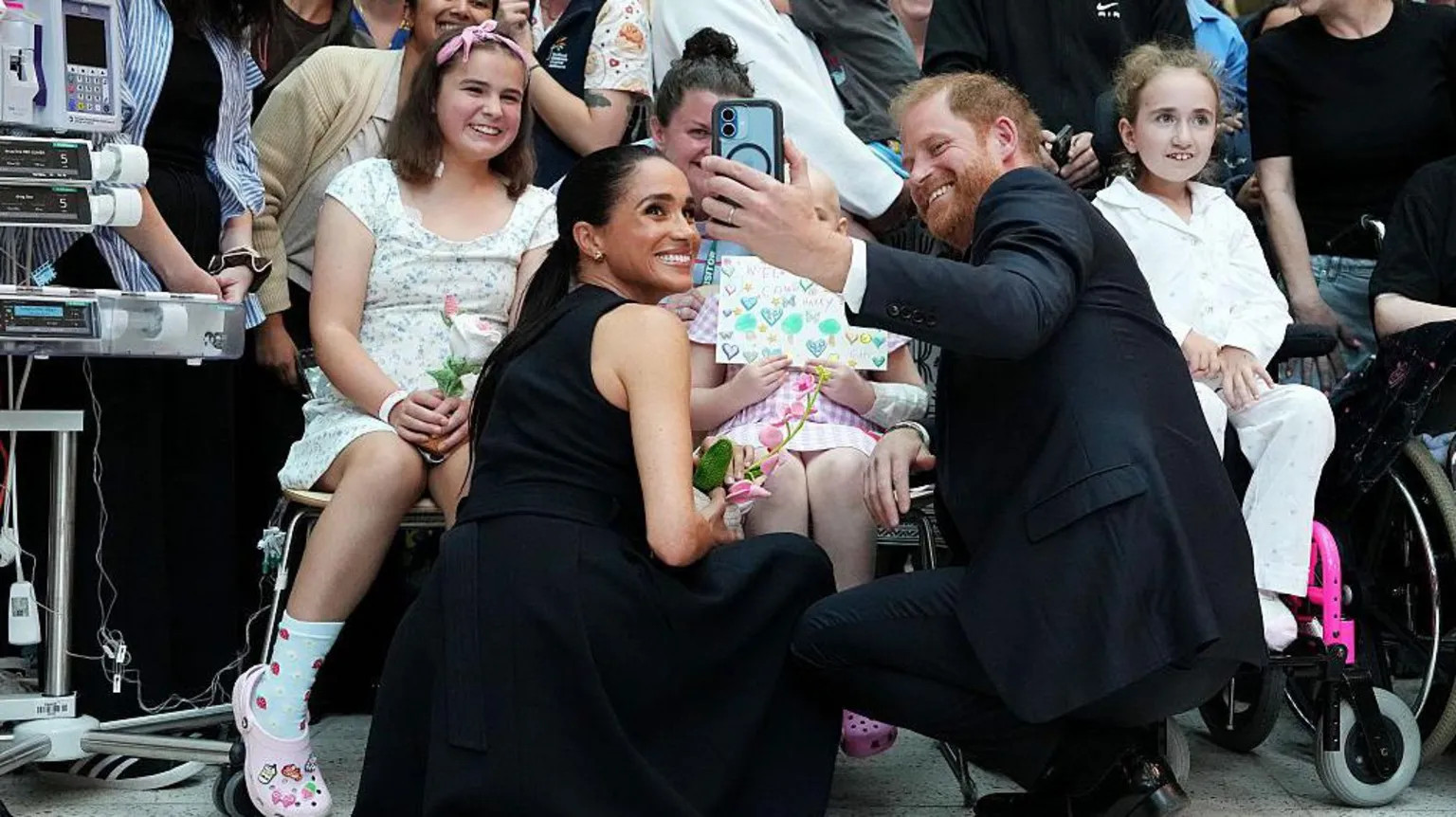 Harry and Meghan balance charity and commerce on Australia tour