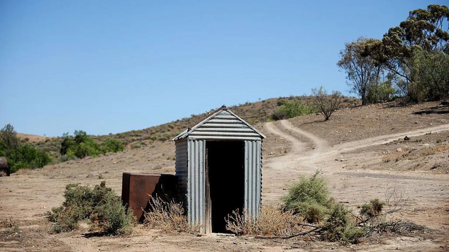 Woman rescued after three-hour ordeal in collapsed outback pit toilet