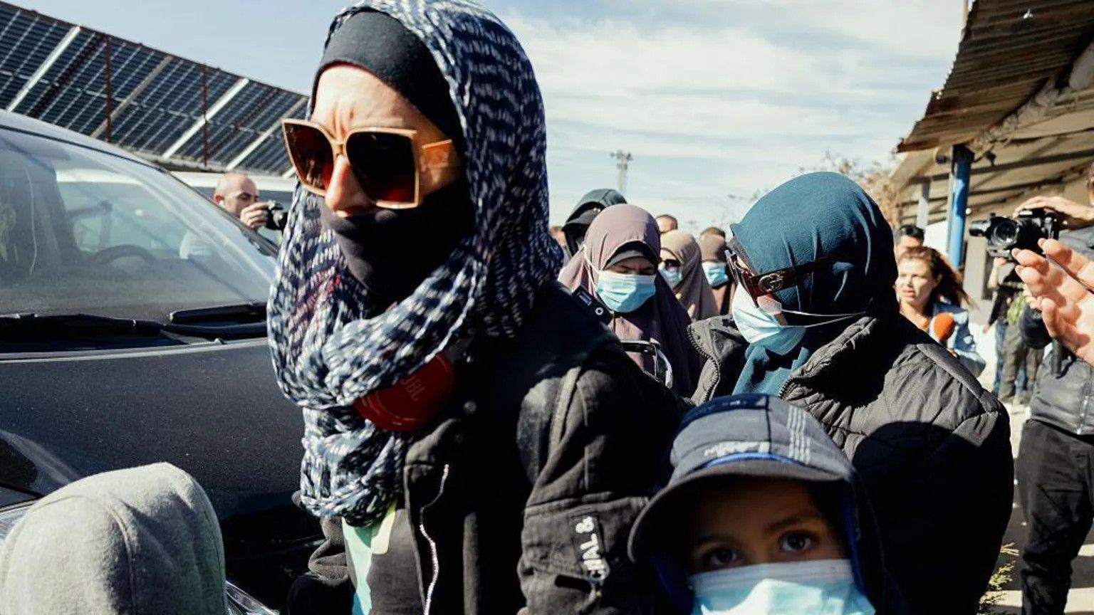 Thirteen IS-linked women and children repatriated to Australia after years in Syrian camp