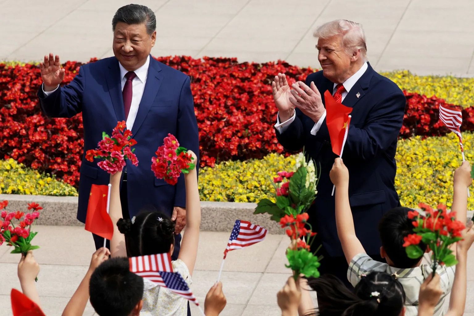 Trump and Xi hold high-stakes talks in Beijing amid global attention