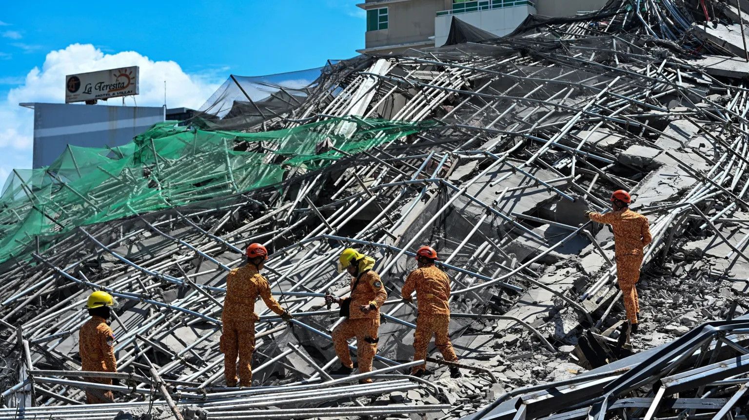 One dead, 20 feared trapped in Philippine building collapse