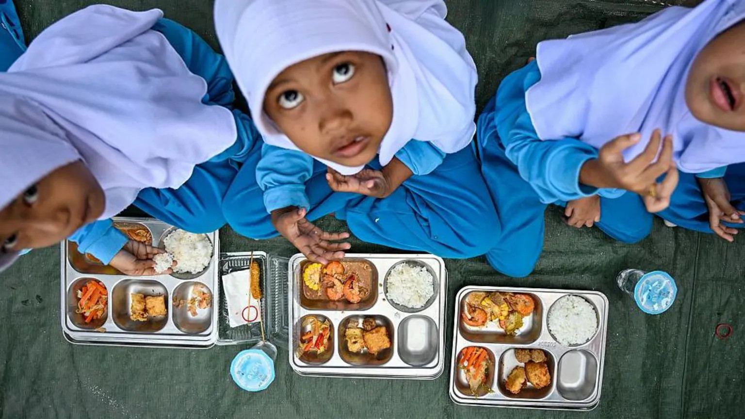 Indonesia replaces head of troubled free school meals programme after mass poisonings