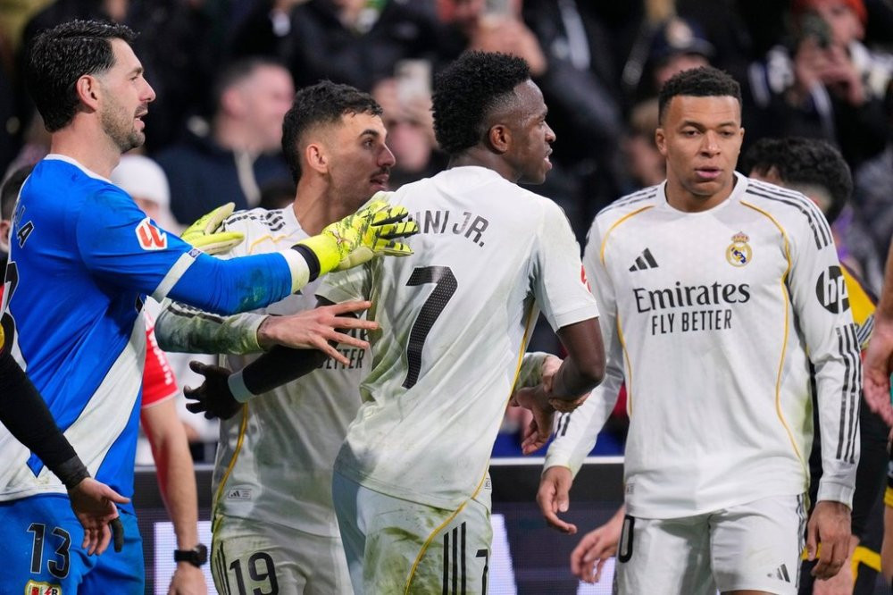 Real Madrid advance to Champions League last 16 amid racism row
